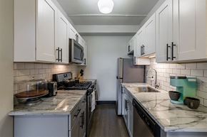 Chicago apartment for rent - The Edison apartments kitchen with stainless appliances and white cabinetry