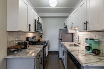 Modern kitchen with granite countertops*