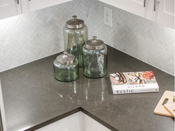 Quartz countertops with tiled backsplash