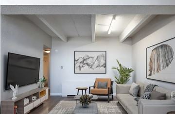 Aurora apartment for rent - A living room with a grey couch, a black television, and a large abstract painting on the wall.