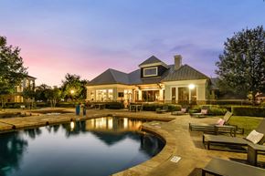 Round Rock apartment for rent - A house with a pool in front of it.