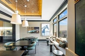 Houston apartment for rent - A modern dining room with a glass table and chairs.