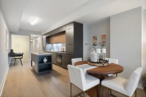 Washington apartment for rent - A modern kitchen with a dining table and chairs.