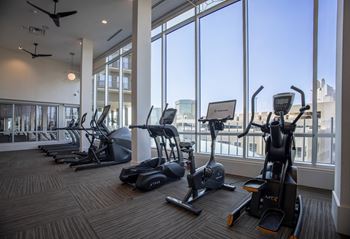 Full fitness club featuring a cell phone lounge and yoga/trx studio