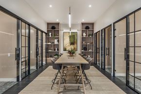 Stamford apartment for rent - A modern dining room with a long table and chairs.