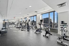 Arlington apartment for rent - A gym with a row of treadmills and elliptical machines.