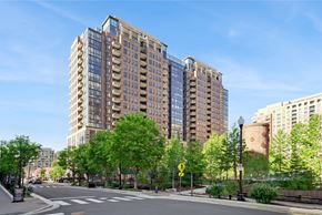 Arlington apartment for rent - A tall building with a lot of windows is in the background.