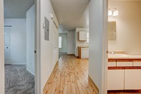 Fort Collins apartment for rent - the view of a spacious living room and bathroom from the entrance of a house