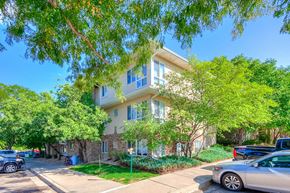 Fort Collins apartment for rent - an apartment building with cars parked in front of it