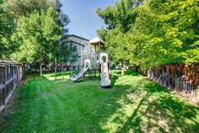 Fort Collins apartment for rent - a backyard with a playground and a swing set