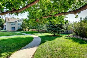 Fort Collins apartment for rent - a walkway through a yard in front of a house