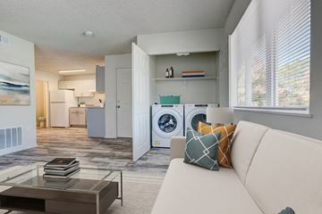 Fort Collins apartment for rent - a living room with a couch and a washing machine