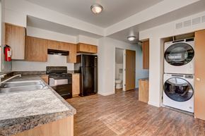 Fort Collins townhouse for rent - a kitchen with a washing machine and a washer and dryer