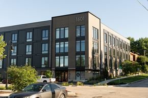 Des Moines apartment for rent - A grey car is parked in front of a building with the number 1601 on it.