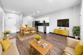 Des Moines apartment for rent - A modern living room with a wooden floor and furniture.