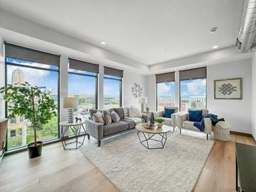 Des Moines apartment for rent - a living room with large windows and a rug