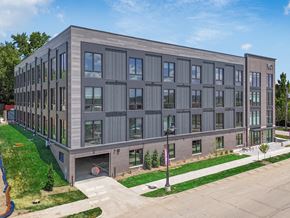 Des Moines apartment for rent - a new apartment building on the corner of a sidewalk