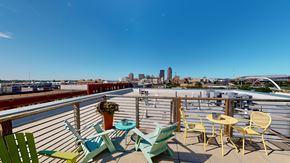 Des Moines apartment for rent - A balcony with a view of the city skyline.