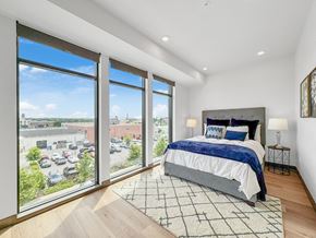 Des Moines apartment for rent - a bedroom with a bed and large windows