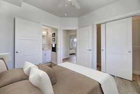 Helena apartment for rent - A bedroom with a bed and a ceiling fan.