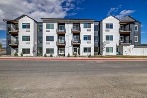 Helena apartment for rent - A Twin Creek Apartments a modern apartment buildings with balconies and multiple windows.