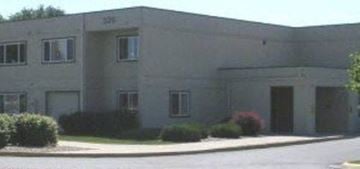 Kalispell apartment for rent - a large white building with a street in front of it