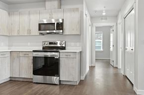 Caldwell apartment for rent - A modern kitchen with a stainless steel oven and microwave.