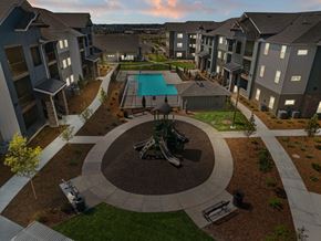 Caldwell apartment for rent - A view of a courtyard with a pool and a gazebo.