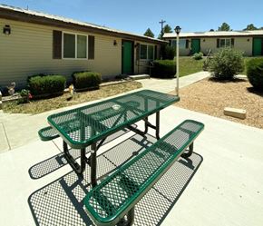 Panaca apartment for rent - picnic area with a picnic table with benches in front of a unit