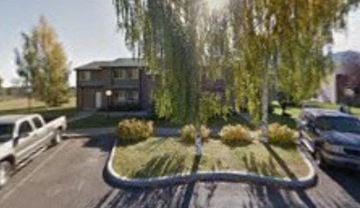 Hailey apartment for rent - a street with cars parked in front of a house