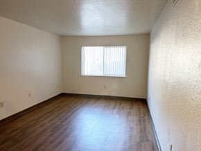 Mariposa apartment for rent - Living room with wood vinal, and window with blinds