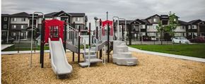 Caldwell apartment for rent - a playground in front of an apartment complex