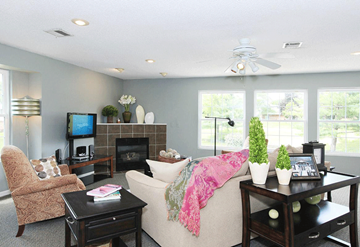 Springfield apartment for rent - a living room with a couch and a ceiling fan