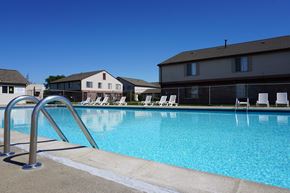Clinton Twp apartment for rent - Outdoor swimming pool with sundeck at Farmbrooke Manor Apartments in Clinton Township MI