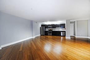 Kalamazoo apartment for rent - A kitchen with a wooden floor and spacious living room in Kalamazoo, MI