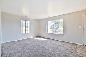 Clinton Twp apartment for rent - Spacious living room with natural light at Farmbrooke Manor Apartments in Clinton Township MI