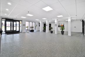 Southfield apartment for rent - A spacious office with grey flooring and white walls.
