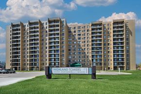 Southfield apartment for rent - The Highland Towers senior apartment complex is a large building with a sign in front of it.