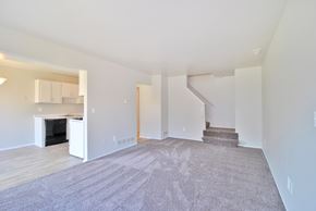 Clinton Twp apartment for rent - Open-concept living room with dining area and kitchen at Farmbrooke Manor Clinton Township MI