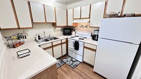 South Lyon apartment for rent - the preserve at ballantyne commons apartment kitchen with white appliances