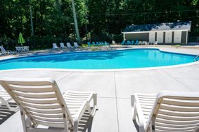 Westland apartment for rent - Swimming pool and pool chairs at Woodcrest Apartments in Westland, Michigan