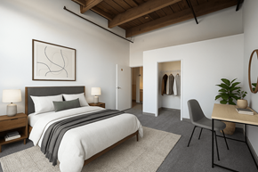 Grand Rapids apartment for rent - A bedroom with a large bed and a chair.