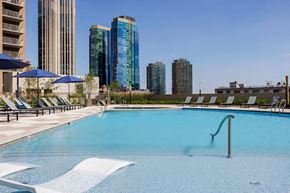Jersey City apartment for rent - A swimming pool with a city skyline in the background.