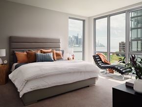 West New York apartment for rent - a bedroom with a bed and a view of the city