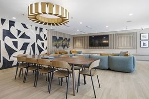 West New York apartment for rent - A modern dining room with a large table and chairs.