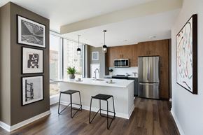 Jersey City apartment for rent - A kitchen with a white counter top and a refrigerator.