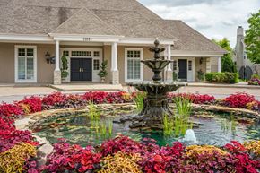 Overland Park apartment for rent - a fountain in a garden in front of a house