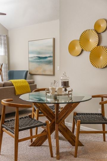 Overland Park apartment for rent - a living room with a glass table and chairs