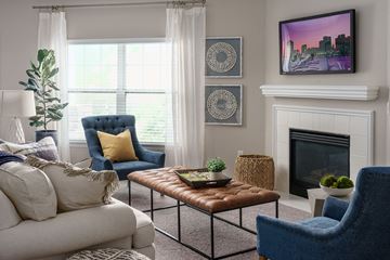 Overland Park apartment for rent - a living room filled with furniture and a fireplace