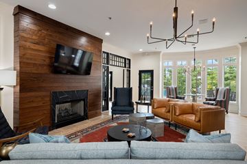Overland Park apartment for rent - a living room with couches and a fireplace and a tv